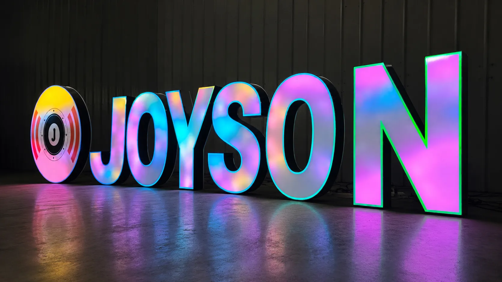 Custom RGB front lit channel letters with black metal frame and colorful acrylic face